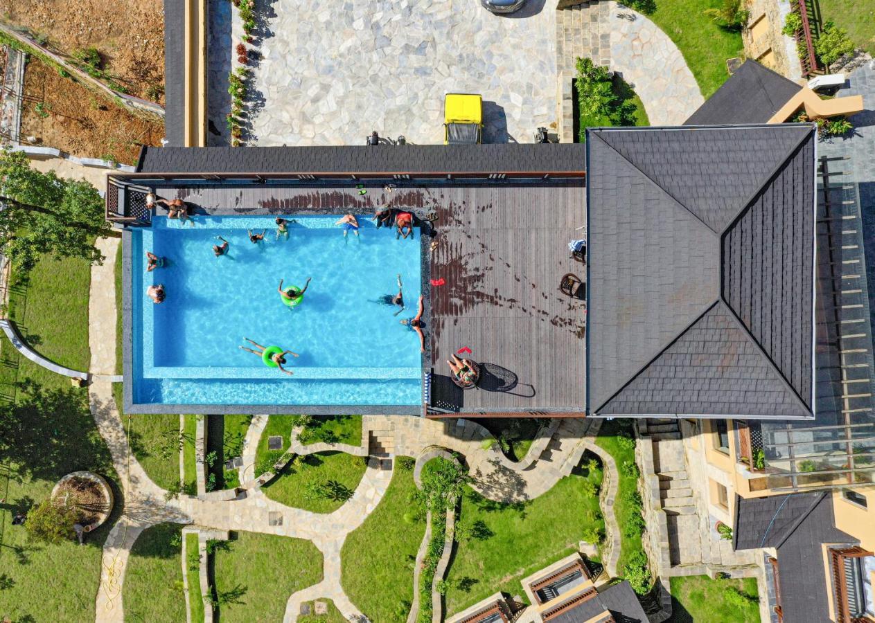Bar Peepal Resort Покхара Экстерьер фото Aerial view of the pool